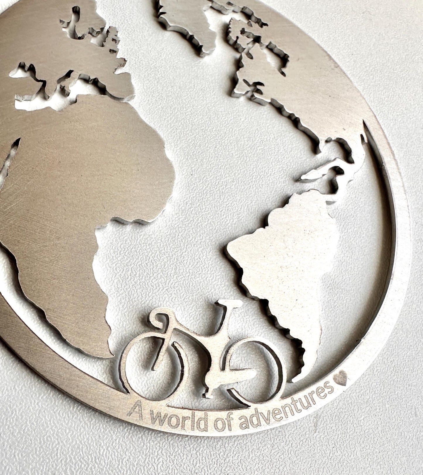 engraving on world ornament