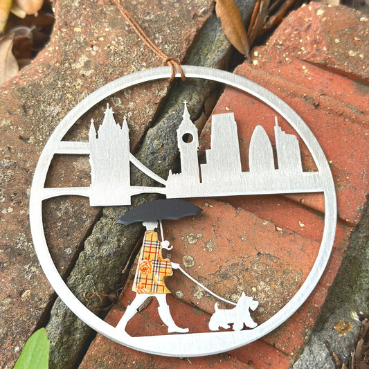a metal clock with a picture of a giraffe on it