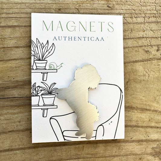 Shitzu magnet made of stainless steel placed on an illustrated card