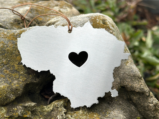 a piece of paper with a heart cut out of it